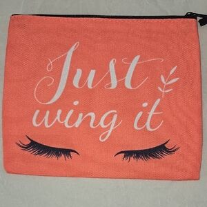Vibrant Orange Cosmetic Bag with Spacious Interior and Durable Material